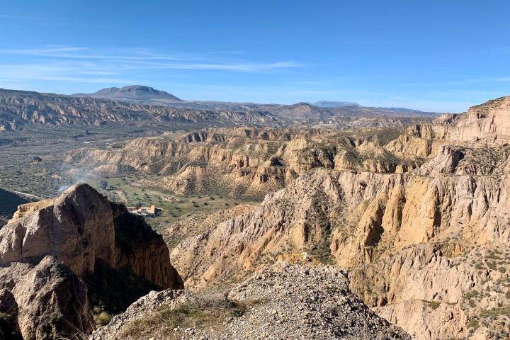 a canyon with a mountain in the background